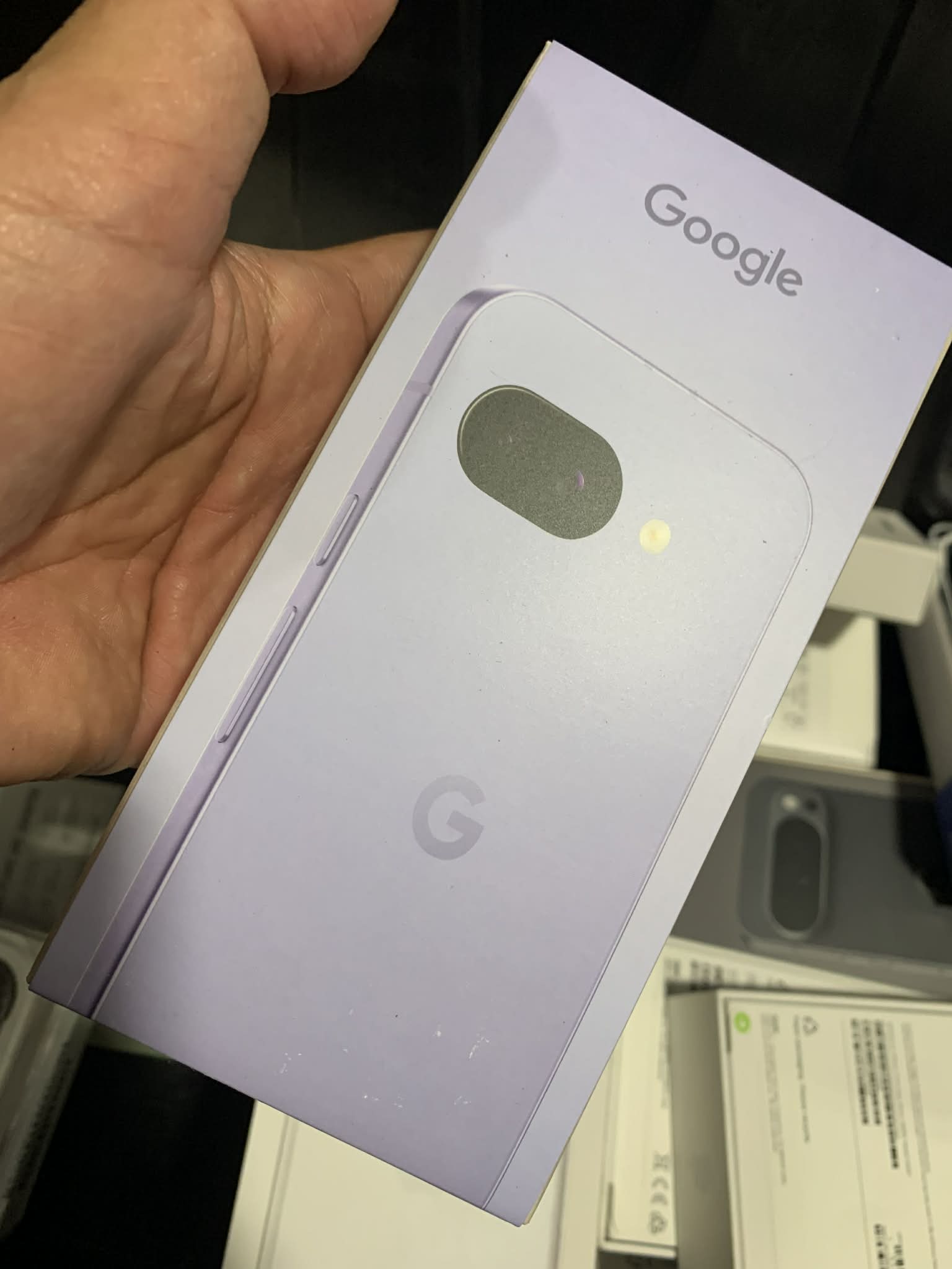 Google Pixel 9a smartphone being used outdoors, showing its camera interface and clean Android software on a bright display