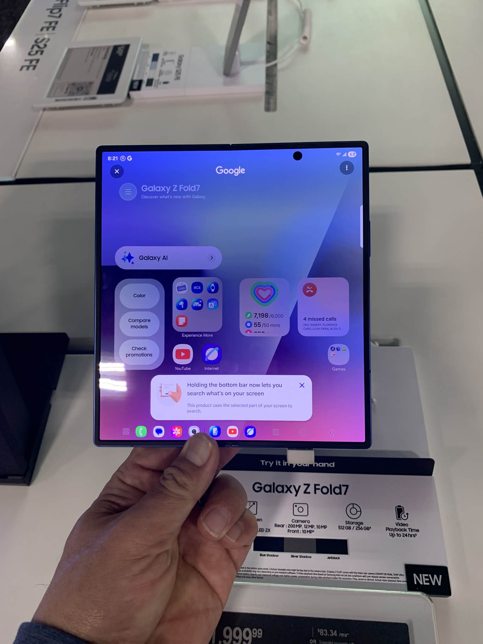 Samsung Galaxy Z Fold7 unfolded on a wooden desk, showing multi-window apps for productivity next to a coffee cup